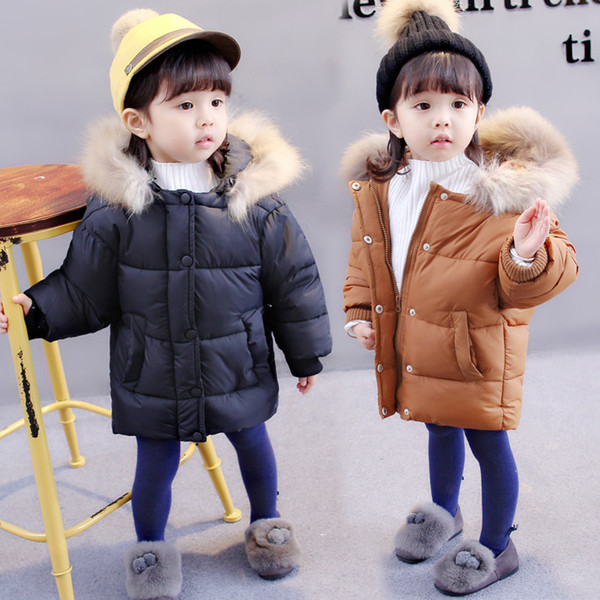 Χειμερινό μπουφάν για αγόρια σε καφέ και μαύρο με κουκούλα και γούνα