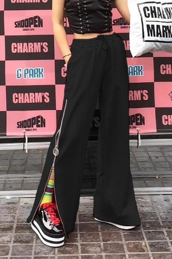 Спортно-елегантен дамски панталон в широк модел с цип