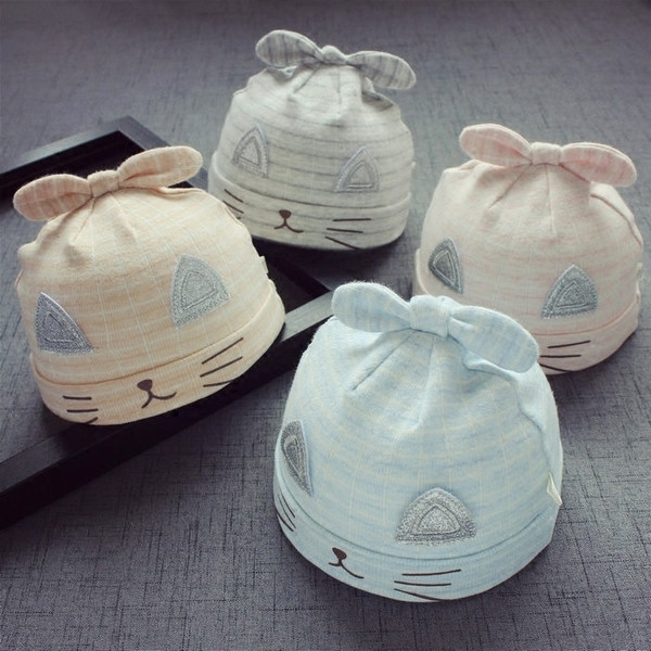 Бебешка шапка в няколко разцветки с панделка