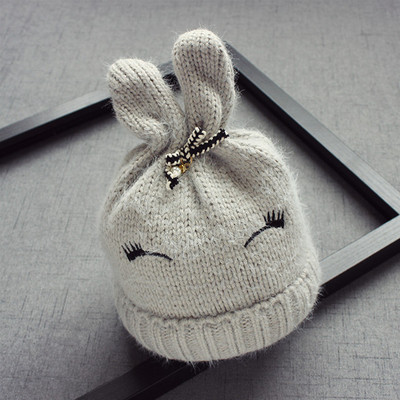 Вълнена детска шапка за момичета с ушички и панделка