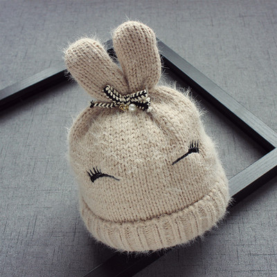 Вълнена детска шапка за момичета с ушички и панделка