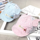 Бебешка шапка с козирка и декорация в четири цвята