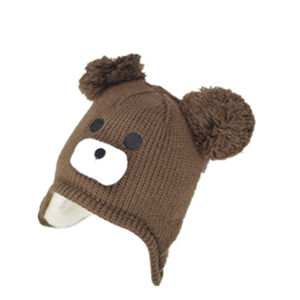 Топла детска плетена шапка с декорация
