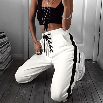 Актуален дамски панталон в бял цвят с висока талия и връзки