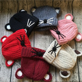 Дебела унисекс зимна шапка с ушички и декорация в шест цвята