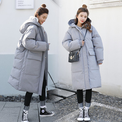 Зимна дълга дамска грейка - актуален модел с големи джобове и качулка