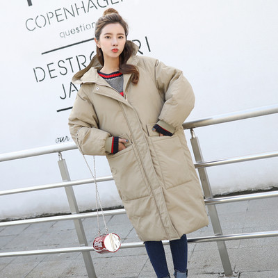 Зимна дълга дамска грейка - актуален модел с големи джобове и качулка