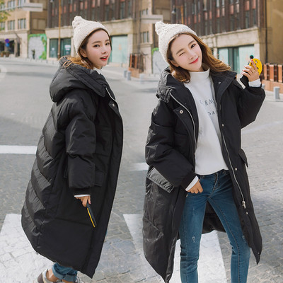 Зимна дълга дамска грейка - актуален модел с големи джобове и качулка