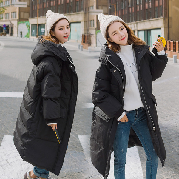 Зимна дълга дамска грейка - актуален модел с големи джобове и качулка