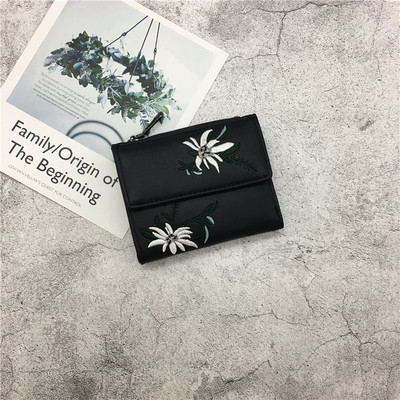 Γυναικείο πορτοφόλι με φυτικά μοτίβα σε διάφορα χρώματα