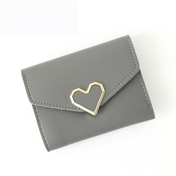 Дамски семпъл портфейл с метална декорация във формата на сърце