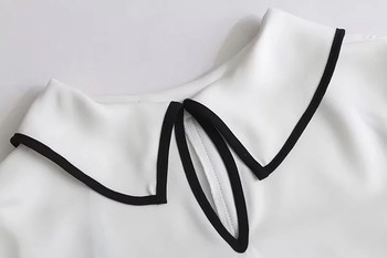 Семпла дамска блуза , свободен модел в бял цвят 