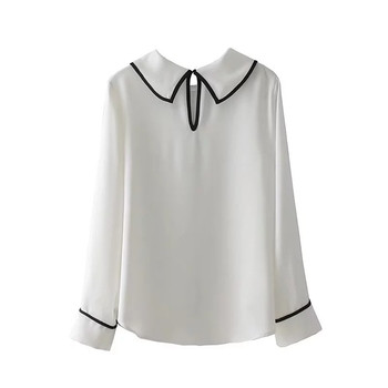 Семпла дамска блуза , свободен модел в бял цвят 