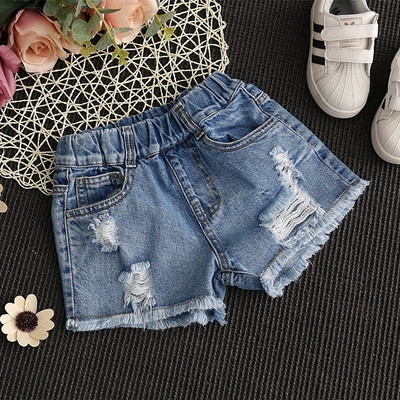Children`s jeans for girls with patches in light color