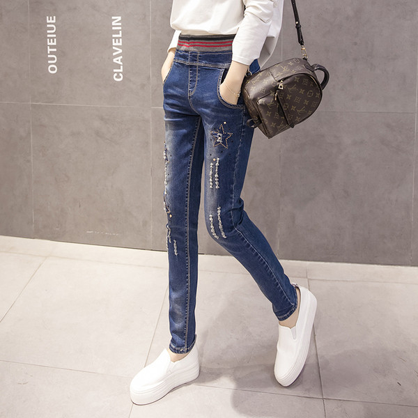 Γυναικεία ελαστικά υψηλά τζιν με κεντήματα και τσέπες