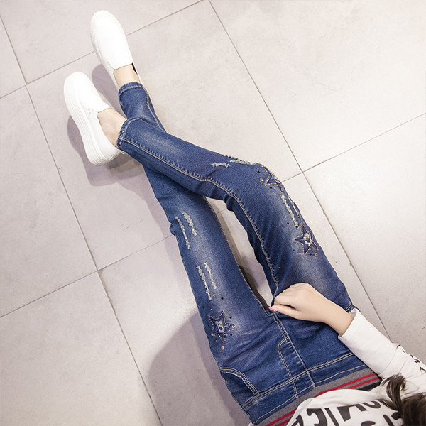 Γυναικεία ελαστικά υψηλά τζιν με κεντήματα και τσέπες