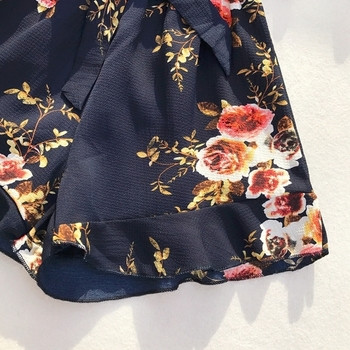 Κομψό καλοκαιρινό ολόσωμο παντελόνι με floral μοτίβο σε σκούρο μπλε χρώμα