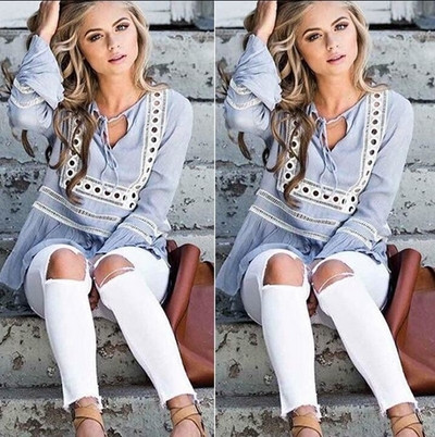Bluză blândă de damă cu mâneci largi într-un stil liber