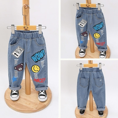 Modern children`s jeans for girls and boys with interesting applications