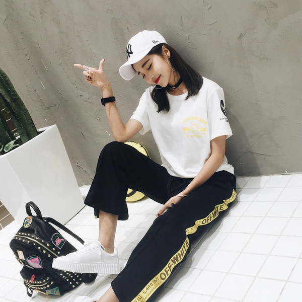 Γυναικεία μπλούζα με επιγραφή και εκτύπωση στην πλάτη σε μαύρο και άσπρο χρώμα