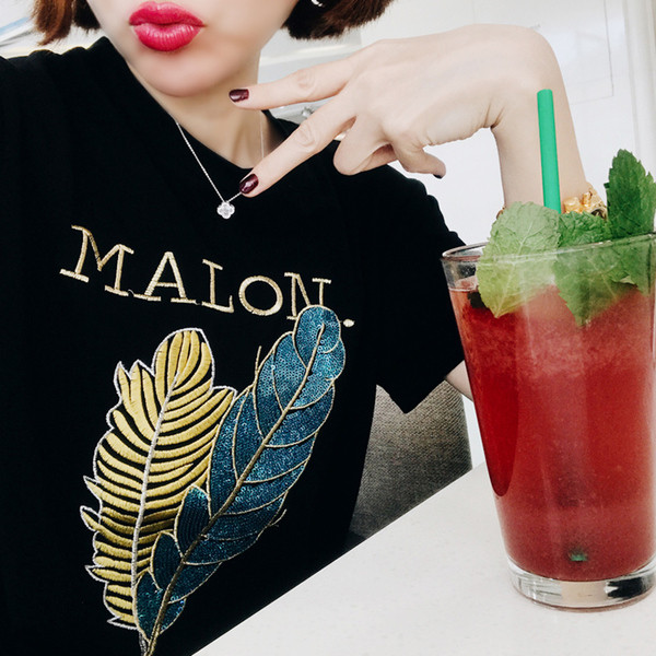 Érdekes felvitelű női póló fekete színben