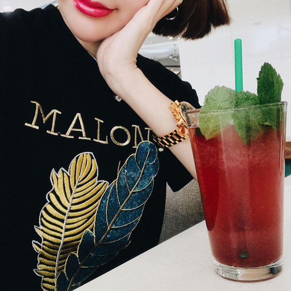 Érdekes felvitelű női póló fekete színben