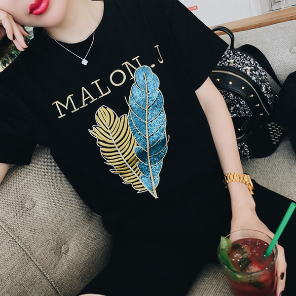 Érdekes felvitelű női póló fekete színben