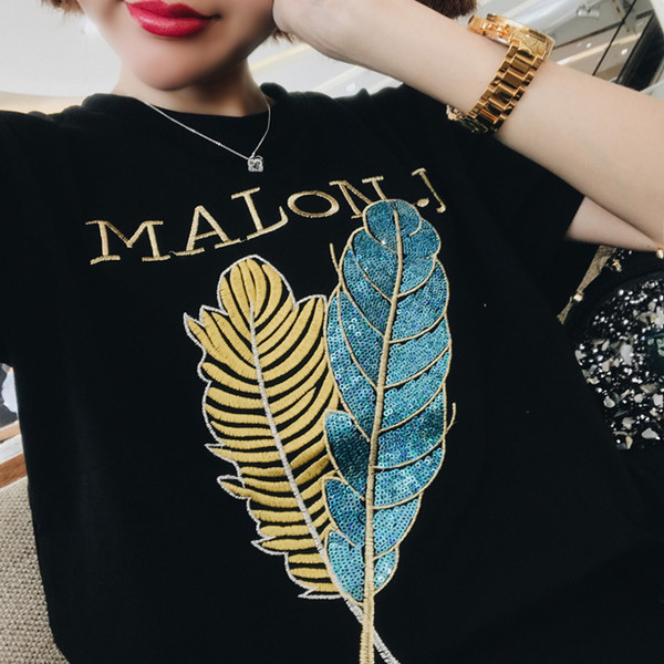 Érdekes felvitelű női póló fekete színben