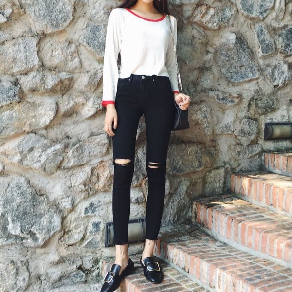 Pantaloni de damă cu talie înaltă cu elemente rupte