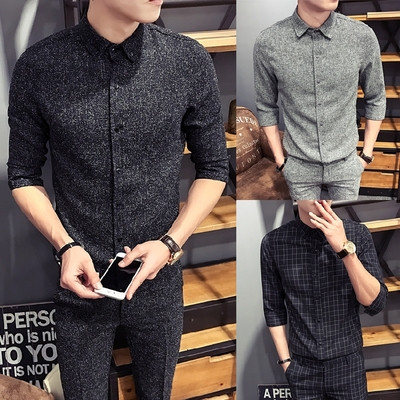 Stylish men`s suit in two parts - shirt and pants in black and gray