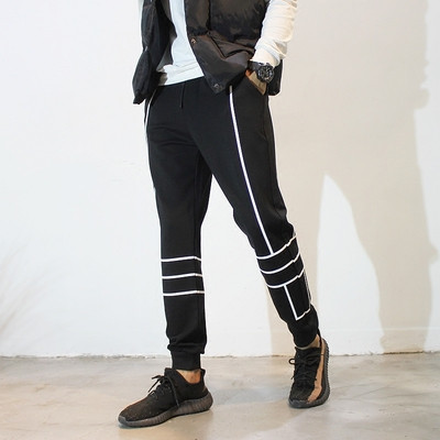 Men`s sports pants in black with white stripes