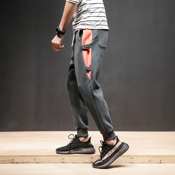 Férfi sportnadrág két színben, színes szalagokkal