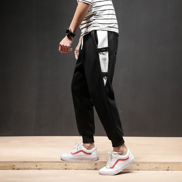 Férfi sportnadrág két színben, színes szalagokkal