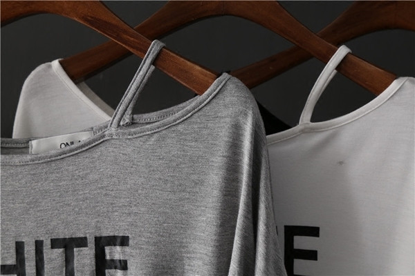 Καθημερινή γυναικεία μπλούζα  με πτώση ώμου και ασύμμετρο μήκος