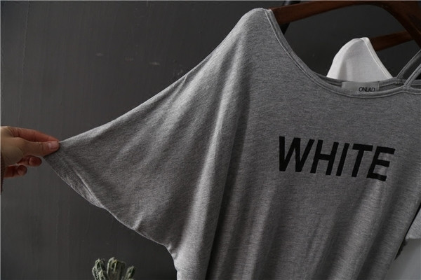 Καθημερινή γυναικεία μπλούζα  με πτώση ώμου και ασύμμετρο μήκος