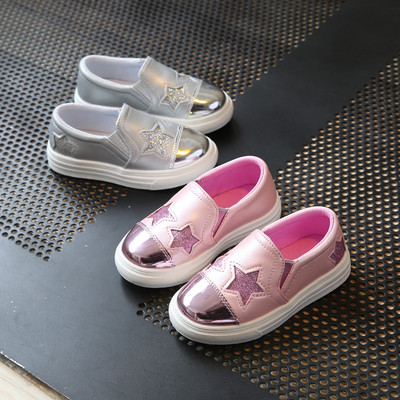 Modern children`s moccasins for girls with appliqué stars and shiny particles in gray and pink