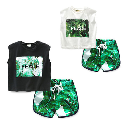 Children`s sports team for boys in a tank top and shorts with floral motifs