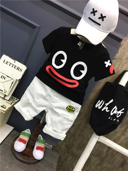 Αθλητικό κομψό σετ μπλούζας με εφαρμογές και  παντελόνια με σχισμένα στοιχεία 