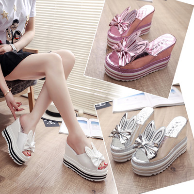 Interesting summer women`s slippers on a high platform with ears and a ribbon in three colors