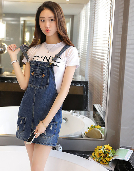 Női overall állítható pántokkal, zsebekkel és fém elemekkel