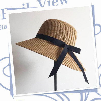 Modern women`s beach hat with colored ribbon in different colors
