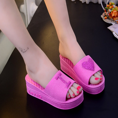 Casual women`s slippers on a high platform in different colors
