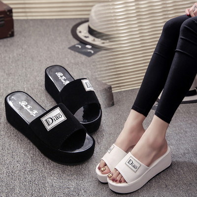 Casual women`s slippers in white and black