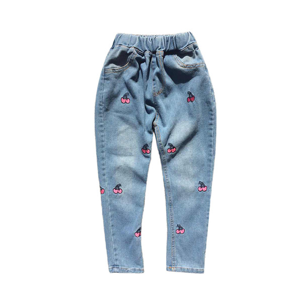 Κομψά παιδικά τζιν για κορίτσια με εφαρμογές σε μπλε χρώμα