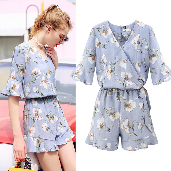 Salopetă de damă elegantă cu motiv floral, cu decolteu în V, în albastru