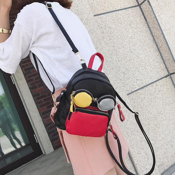 Rucsac mic de dama din piele ecologica in doua culori cu buzunare colorate