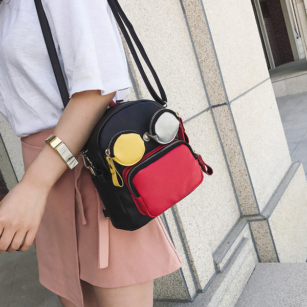 Rucsac mic de dama din piele ecologica in doua culori cu buzunare colorate