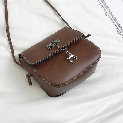 Geanta de dama din piele ecologica in marime mini cu curea lunga si element metalic