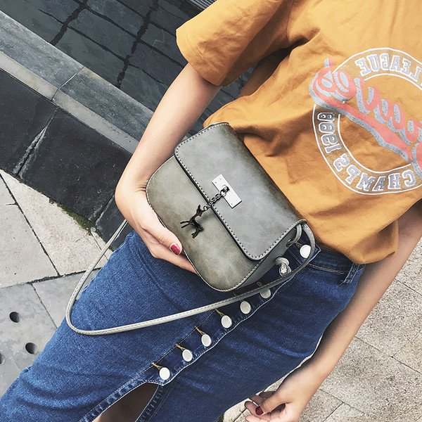 Geanta de dama din piele ecologica in marime mini cu curea lunga si element metalic