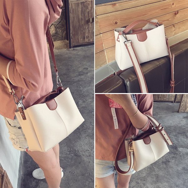 Stílusos kézitáska második színű díszítéssel